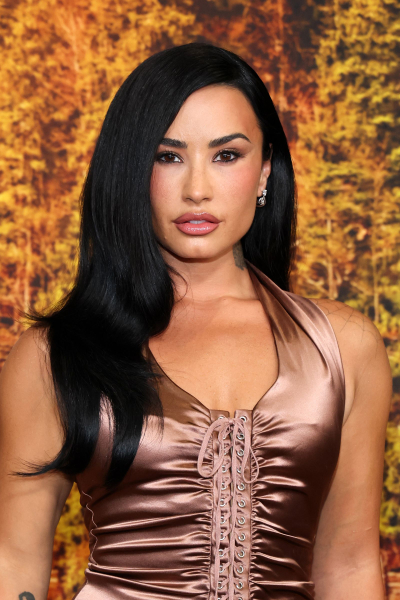 Demi Lovato wearing a bronze dress
