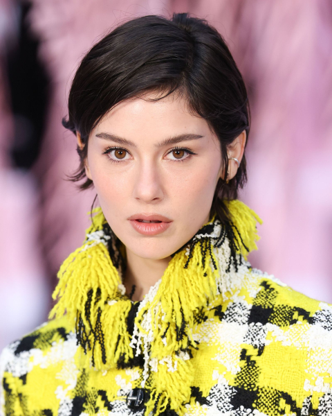 Gracie Abrams wearing a yellow plaid coat