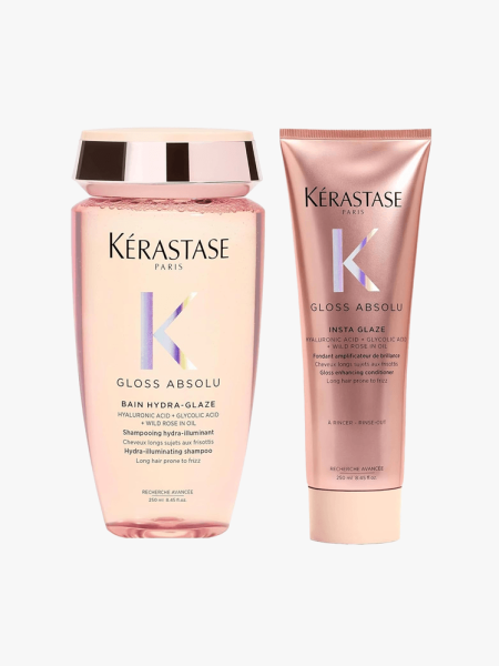 Kérastase Gloss Absolu Shampoo and Conditioner in branded components on a light gray background