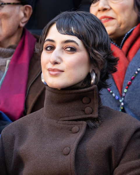 Rama Duwaji in a brown coat