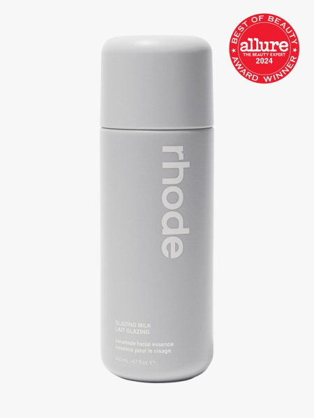 milky toner in branded gray bottle with cap on light gray background with red and white 2024 allure best of beauty seal